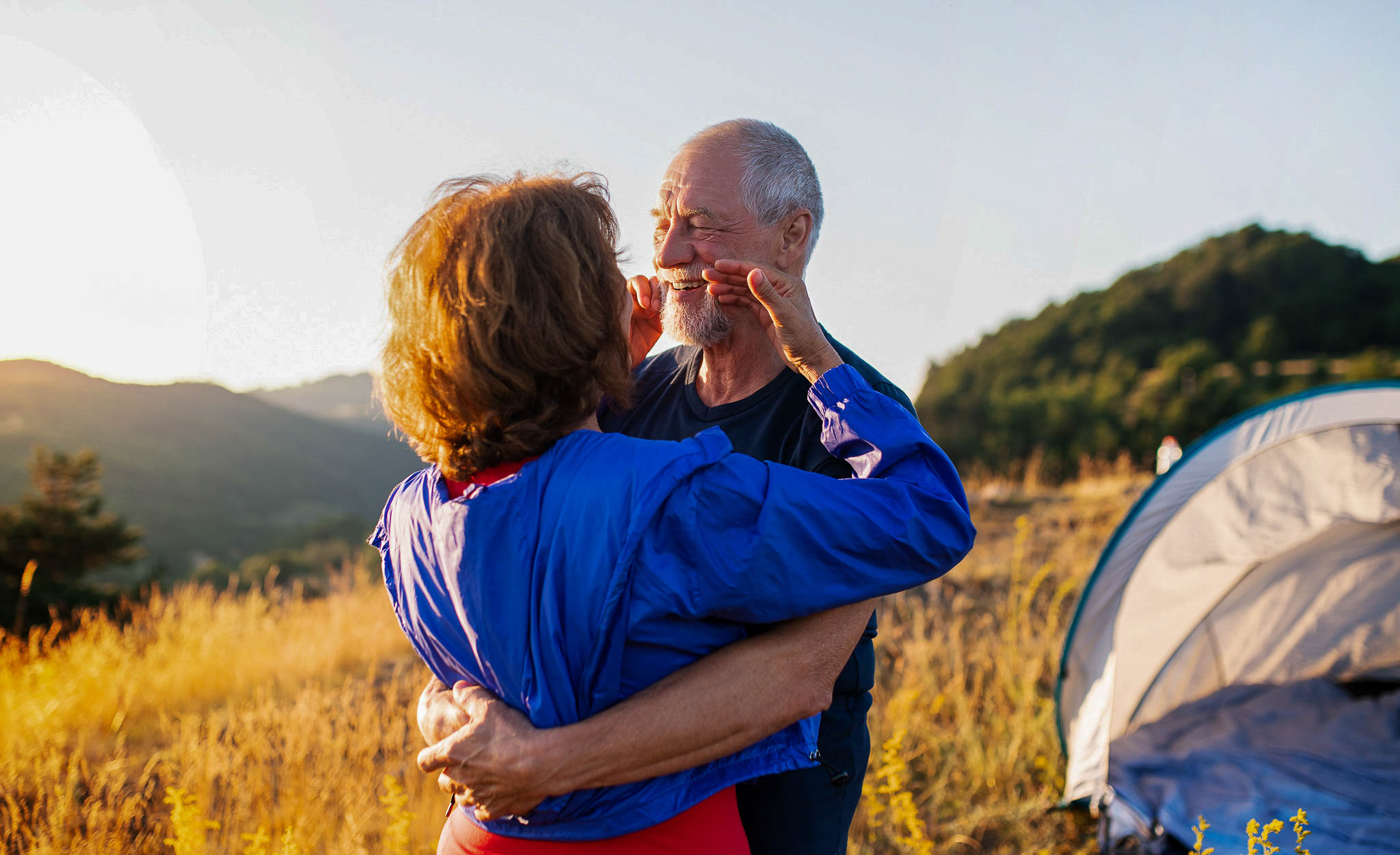 Couple embracing at mountain sunset