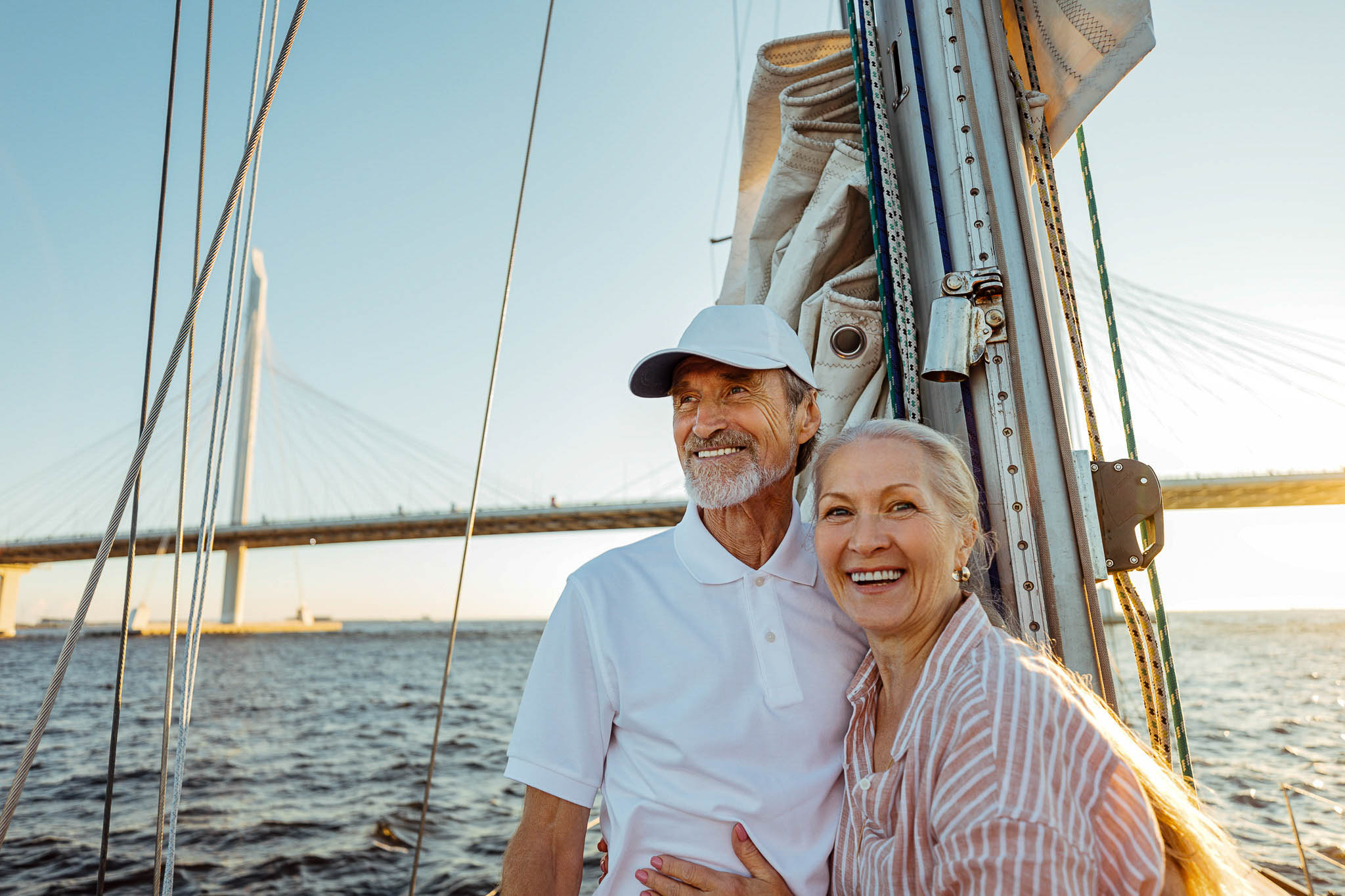 Couple smiling on sailboat